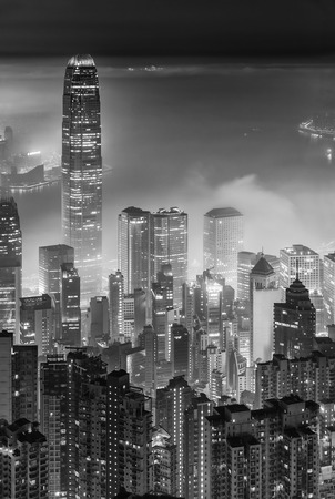 Misty night view of Victoria harbor in Hong Kong cityの写真素材