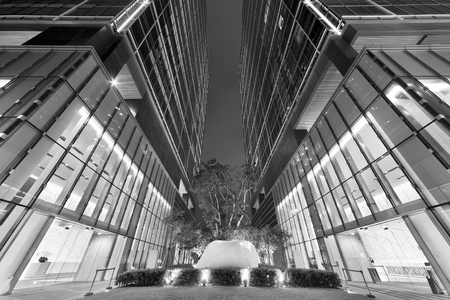 Business office building in Hong Kong city at nightの写真素材