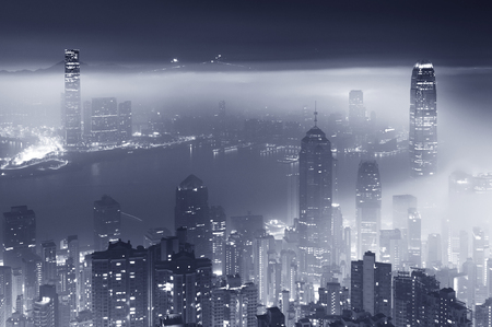 Misty night view of Victoria harbor in Hong Kong cityの写真素材