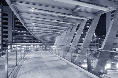 Empty pedestrian transition over busy street in urban cityの写真素材