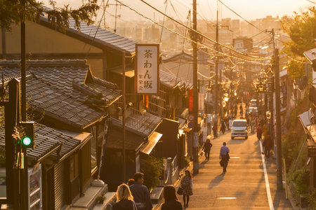 KYOTO, JAPAN - April 8, 2016 : Tourists walking in historical street around Kiyomizu Temple, Kyoto, Japan under sunsetのeditorial素材
