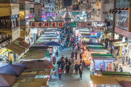 Hong Kong, China - December 09, 2017: Fa Yuen street market in the Mongkok district, viewed from an overhead walkway. Mongkok in Kowloon Peninsula is the most busy and overcrowded district in Hong Kongのeditorial素材
