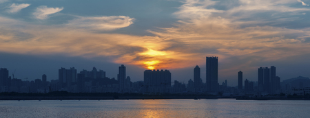 Panorama of Skyline of Hong Kong city under sunsetの写真素材