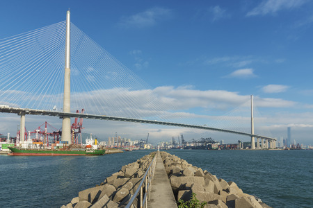 Cargo port, suspension bridge and dam in Harborの写真素材