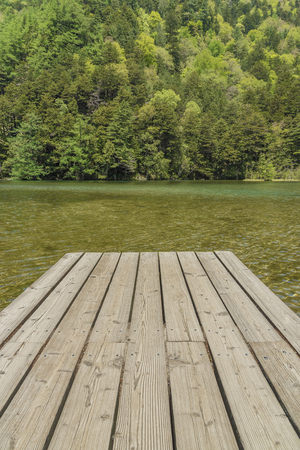 Jetty in Myojin pond at Hotaka Rear Shrine in Kamikochi, Nagano, Japan.の写真素材