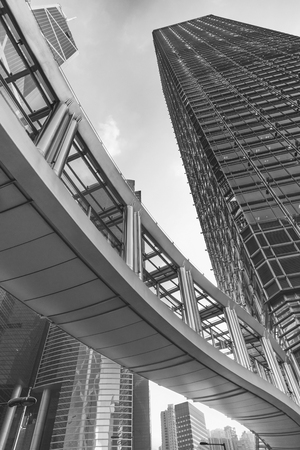 Modern office building and pedestrian walkway in Hong Kong cityの写真素材