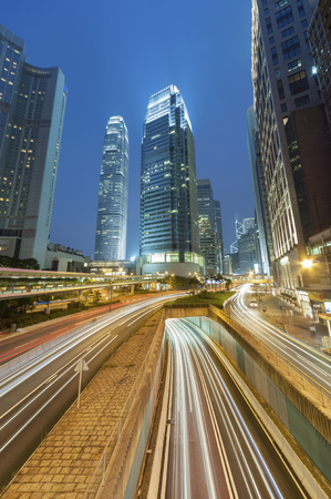 Night traffic in central district of Hong Kong city at nightの写真素材