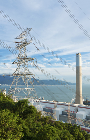 Electric pylon and chimney of Power plantの写真素材