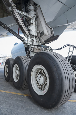 Close up of aircraft wheel at hangarの写真素材