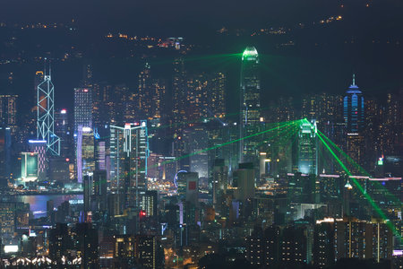 Hong Kong skyline at night with laser light showのeditorial素材