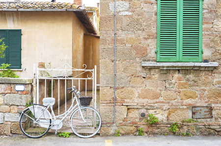 Bicycle in charming street in old town Pienza of Tuscany, Italy, Europeの写真素材