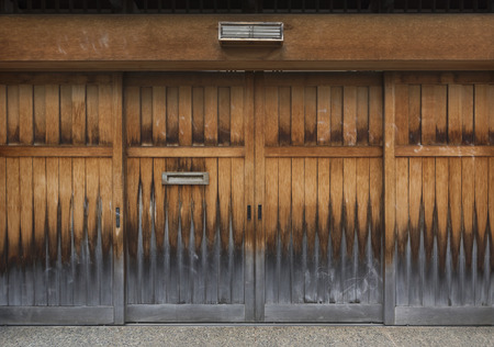 Antique wooden door in Japanの写真素材