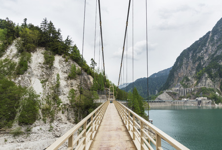 Suspension bridge in Tateyama Kurobe Alpine Route in Japanの写真素材