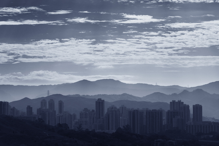 silhouette city skyline and mountain. landscape of Hong Kong at dawnの写真素材