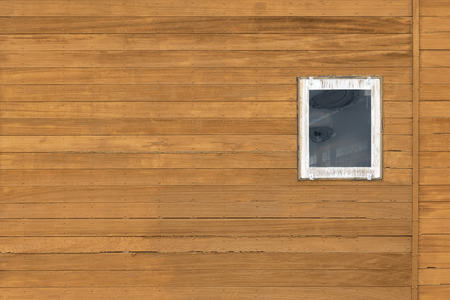 awning window on exterior of wooden house