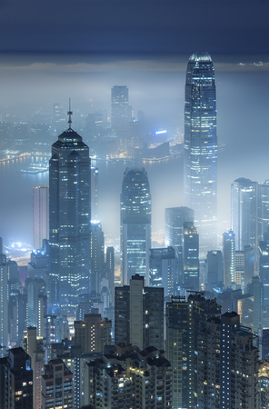 Misty night view of Victoria harbor in Hong Kong cityの写真素材