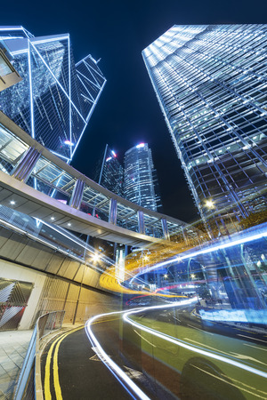 Car Traffic in central district of Hong Kong city at nightの写真素材