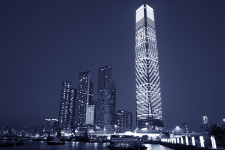 Skyscraper in Victoria harbor of Hong Kong city at duskの写真素材