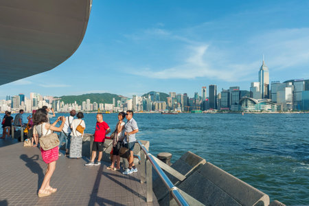 Hong Kong , China - August 12, 2013 : Traveler visiting the Tsim Sha Tsui Promenade (Avenue of the Stars) in Hong Kong. The Avenue is located along the Victoria Harbor in Hong Kong.のeditorial素材