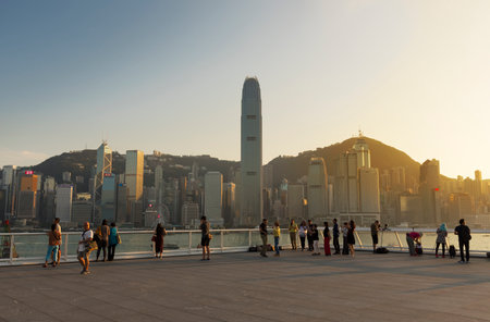 Hong Kong, China - September 21, 2018 : tourist enjoying the scenery of Victoria harbor in Hong Kong city under sunsetのeditorial素材