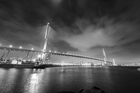 Suspension bridge in Hong Kong harbor at night