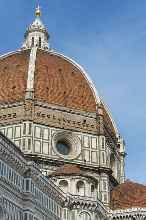 The dome and cross of the Basilica di Santa Maria del Fiore (Basilica of Saint Mary of the Flower). View from Giotto's Campanile. Florence, Tuscany, Italy.の写真素材