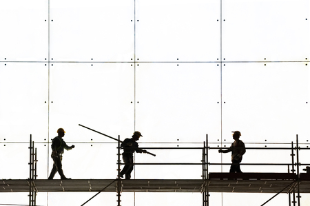 silhouette of construction worker at workの写真素材