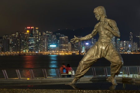 Hong Kong, China - Feburary 22, 2019 : Bruce Lee statue on the Avenue of Stars in Tsim Sha Tsui, Hong Kong. The statue is one of the main attractions on the famous waterfront promenade.のeditorial素材