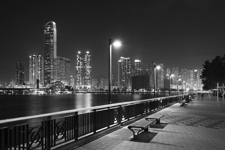 Seaside Promenade of Harbor in Hong Kong city at nightの写真素材