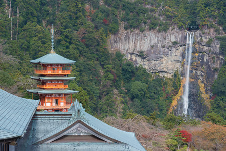 Scenic view of pagoda of Seiganto-ji Temple with Nachi no Taki waterfall in background at Nachi Katsuura, Wakayama, Japanのeditorial素材