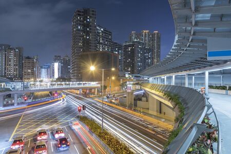 Traffic and skyline of downtown of Hong Kong city at night