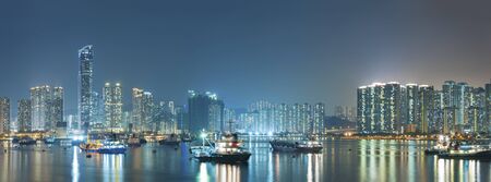 Panorama of harbor of Hong Kong city at night