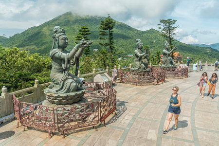 Hong Kong, China - July 26, 2019 : Tourist visiting Tian Tan Buddha statue in Chinese temple Po Lin Monastery in Lantau island, Hong Kongのeditorial素材