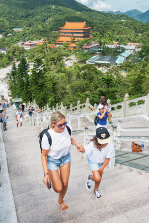 Hong Kong, China - July 26, 2019 : Tourist visiting Tian Tan Buddha statue in Chinese temple Po Lin...