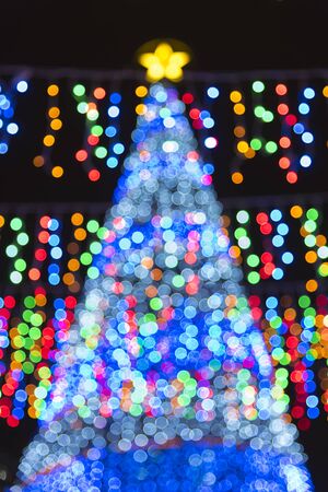Blurred illuminated LED Christmas tree backgroundの写真素材