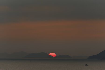 Sunset over outlying island in Hong Kongの写真素材