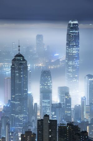 Skyline of Hong Kong city in mist at night