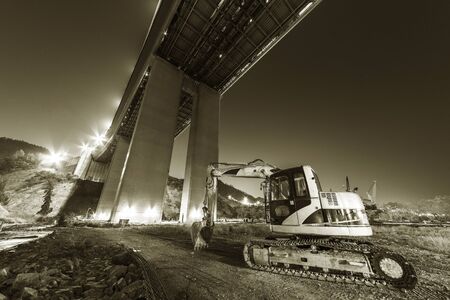 excavator in construction site at nightの写真素材