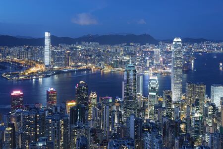 Victoria harbor of Hong Kong city at nightの写真素材