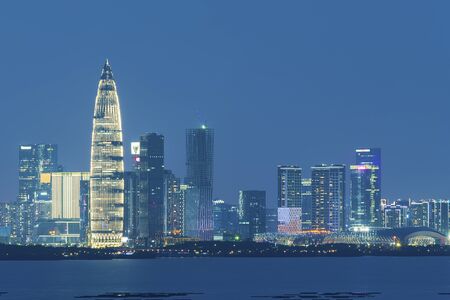 Skyline of Shenzhen city, China at night. Viewed from Hong Kong borderの写真素材
