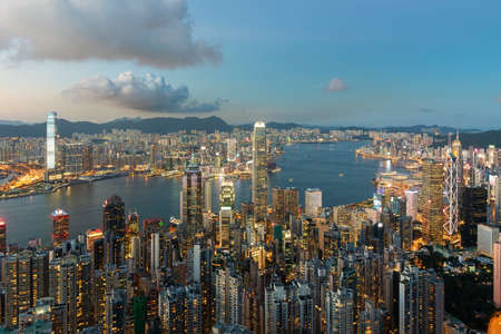 Victoria harbor of Hong Kong city at duskの写真素材