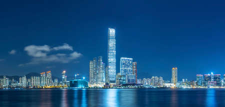 Panorama of skyline of Victoria harbor of Hong Kong city at nightの写真素材