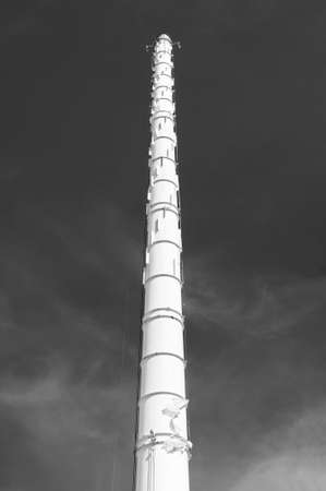Chimney of chemical factory with sky backgroundの写真素材