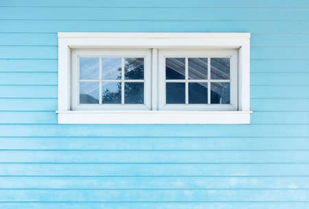 Window on wooden wall. Building abstract background