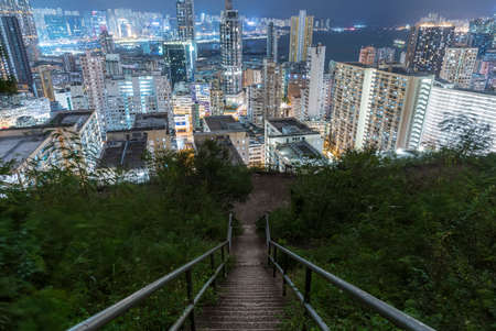 Night scene of downward stairway to downtown of Hong Kong city