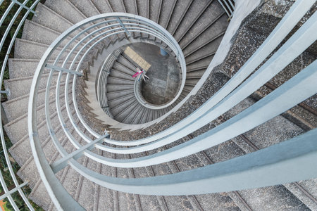 Empty modern spiral stairway, viewed from topの写真素材
