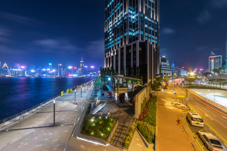 Skyline of Victoria harbor of Hong Kong city at nightの写真素材