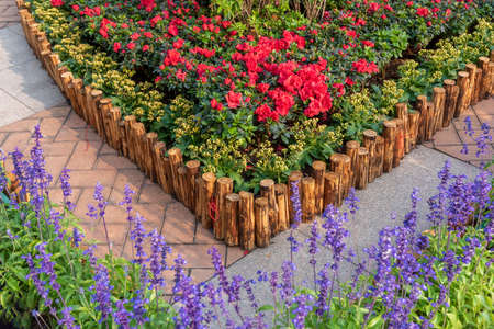 Wooden fence in beautiful backyard flower garden