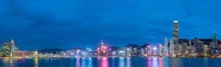 Panorama of Victoria harbor of Hong Kong city at duskの写真素材