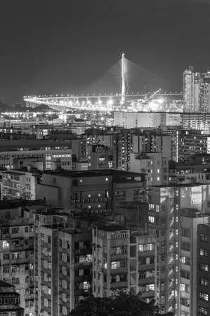 Bridge and high rise building in Hong Kong city at nightの写真素材